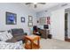 Bedroom with a gray couch, decor, ceiling fan, and adjacent desk and chair at 91 Vivante Blvd # 402/9142, Punta Gorda, FL 33950