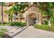 Inviting building entrance with lush landscaping, providing a welcoming atmosphere for residents and guests at 91 Vivante Blvd # 402/9142, Punta Gorda, FL 33950
