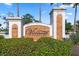 An ornate stone sign for Vivante at Punta Gorda is surrounded by lush green landscaping at 91 Vivante Blvd # 402/9142, Punta Gorda, FL 33950