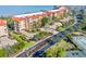 Scenic aerial view of the condo building, highlighting its proximity to the waterfront and beautifully landscaped grounds at 91 Vivante Blvd # 402/9142, Punta Gorda, FL 33950