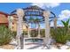 Community hot tub featuring a decorative gazebo, offering a serene spot for relaxation and socializing at 91 Vivante Blvd # 402/9142, Punta Gorda, FL 33950