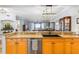 Bright kitchen with granite countertops and views of the dining and living room to the ocean at 91 Vivante Blvd # 402/9142, Punta Gorda, FL 33950