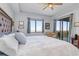 King bed with comfortable chair and walk-out patio at 91 Vivante Blvd # 402/9142, Punta Gorda, FL 33950