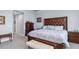 Spacious main bedroom with decorative bed, dresser, and sitting bench at 91 Vivante Blvd # 402/9142, Punta Gorda, FL 33950