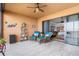 Inviting covered patio with comfortable seating and view to the interior and features a ceiling fan for added comfort at 91 Vivante Blvd # 402/9142, Punta Gorda, FL 33950
