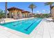 Refreshing community pool with designated lap lanes and cozy cabanas, perfect for exercise and relaxation at 91 Vivante Blvd # 402/9142, Punta Gorda, FL 33950