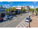 Scenic street view with shops, restaurants, palm trees, and parked cars in Punta Gorda at 91 Vivante Blvd # 402/9142, Punta Gorda, FL 33950