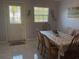 Dining area with table and chairs, near kitchen and exterior door at 12077 Maryland Ave, Punta Gorda, FL 33955