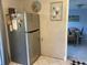 Stainless steel refrigerator in kitchen with adjacent dining area at 12077 Maryland Ave, Punta Gorda, FL 33955