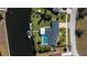 Aerial view of waterfront property with pool and boat dock at 125 Ott Cir, Port Charlotte, FL 33952