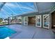 Covered patio overlooking the pool and canal at 125 Ott Cir, Port Charlotte, FL 33952