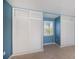 Bedroom with double door closet and window at 125 Ott Cir, Port Charlotte, FL 33952