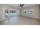 Bright Gathering room with tile floors, access to pool, and water views at 125 Ott Cir, Port Charlotte, FL 33952