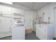 Bright laundry room with washer and dryer at 125 Ott Cir, Port Charlotte, FL 33952