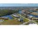 Fantastic aerial view of a condo complex with a tennis court, boat docks and canal access at 1335 Rock Dove Ct # 52, Punta Gorda, FL 33950