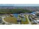 Stunning aerial view of a condo community with a private boat slip, tennis court and canal access at 1335 Rock Dove Ct # 52, Punta Gorda, FL 33950