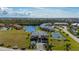 Beautiful aerial shot of a condo complex with a private boat slip on a canal, featuring a tennis court at 1335 Rock Dove Ct # 52, Punta Gorda, FL 33950