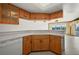 Bright kitchen featuring wood cabinets and countertops, leads to the living space at 1335 Rock Dove Ct # 52, Punta Gorda, FL 33950