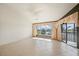 Bright living room featuring tile floors and sliding glass doors to the patio at 1335 Rock Dove Ct # 52, Punta Gorda, FL 33950