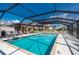 The community screened-in pool offers a refreshing turquoise pool and multiple outdoor seating areas at 1335 Rock Dove Ct # 52, Punta Gorda, FL 33950