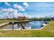 Waterfront community, offering dock access and boat parking, surrounded by lush green grass and foliage at 1335 Rock Dove Ct # 52, Punta Gorda, FL 33950