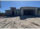 New construction home with attached garage, block exterior, and dark gray roof at 165 Ingram Blvd, Rotonda West, FL 33947