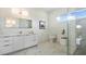 Modern bathroom with marble shower and double vanity at 16506 Cape Horn Blvd, Punta Gorda, FL 33955