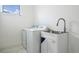 Laundry room with washer, dryer, and utility sink at 16506 Cape Horn Blvd, Punta Gorda, FL 33955