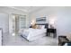 Main bedroom with sliding barn door and marble floors at 16506 Cape Horn Blvd, Punta Gorda, FL 33955