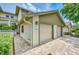 Attractive townhome exterior with two car garage, brick pavers and landscaping at 1710 Starling Dr # 102, Sarasota, FL 34231