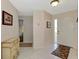 Bright foyer with neutral walls and white tile flooring at 1710 Starling Dr # 102, Sarasota, FL 34231