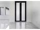 Modern frosted glass double door with black frame at 17200 Mint Ln, Punta Gorda, FL 33955