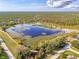 Aerial view of the scenic lake, showing a natural and recreational amenity accessible to the community at 18181 Bly Ave, Port Charlotte, FL 33948