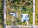 Aerial view showing a house and a separate building on a large lot at 18181 Bly Ave, Port Charlotte, FL 33948