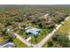 An aerial view of a home nestled in a quiet residential neighborhood at 18181 Bly Ave, Port Charlotte, FL 33948