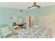 Bright bedroom with coastal decor, desk area, and spacious closet offers a serene retreat at 18181 Bly Ave, Port Charlotte, FL 33948