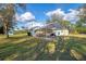 Rear view featuring a boat cover, storage shed and views of the canal at 18181 Bly Ave, Port Charlotte, FL 33948