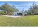 Detached two car garage with an attached two-car carport and circle driveway at 18181 Bly Ave, Port Charlotte, FL 33948