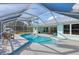 Inviting screened-in pool with ample deck space and seating, offers a perfect outdoor entertainment area at 18181 Bly Ave, Port Charlotte, FL 33948