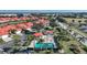 Aerial view showcases the community pool, cabana, palm trees, and well-maintained lawns at 1890 Deborah Dr # 6, Punta Gorda, FL 33950