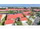 Aerial view of homes with red roofs and waterfront access, showcasing the neighborhood's appealing location at 1890 Deborah Dr # 6, Punta Gorda, FL 33950