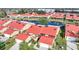 Aerial view of homes with red roofs and waterfront access, highlighting the community's layout and appeal at 1890 Deborah Dr # 6, Punta Gorda, FL 33950