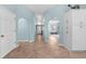 Bright entryway with archways leading to the living spaces and tiled flooring throughout at 1890 Deborah Dr # 6, Punta Gorda, FL 33950