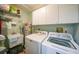 Functional laundry room with washer, dryer, sink, and storage cabinets at 1890 Deborah Dr # 6, Punta Gorda, FL 33950