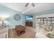 Cozy living room featuring tile flooring, a ceiling fan, and a view of the lanai at 1890 Deborah Dr # 6, Punta Gorda, FL 33950