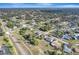 Expansive aerial view of a residential neighborhood featuring tree-lined streets and well-maintained homes at 20352 Tappan Zee Dr, Port Charlotte, FL 33952