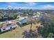 Aerial view of the home showcasing its location, mature trees, and neighborhood at 20352 Tappan Zee Dr, Port Charlotte, FL 33952