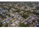 Expansive aerial view of a neighborhood showcasing numerous single-Gathering homes and tree-lined streets at 20431 Calder Ave, Port Charlotte, FL 33954