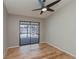 Bedroom with sliding glass doors leading to a screened in lanai and pool area, neutral paint and modern ceiling fan at 20431 Calder Ave, Port Charlotte, FL 33954