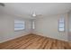 A light-filled bedroom with wood flooring and neutral walls at 20431 Calder Ave, Port Charlotte, FL 33954